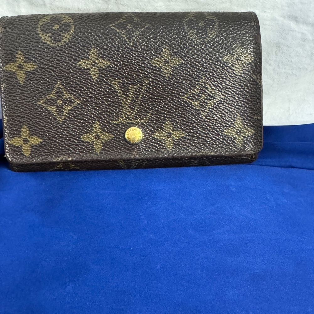 LV compact snap wallet repaired by Concierge Cobbler of NYC.